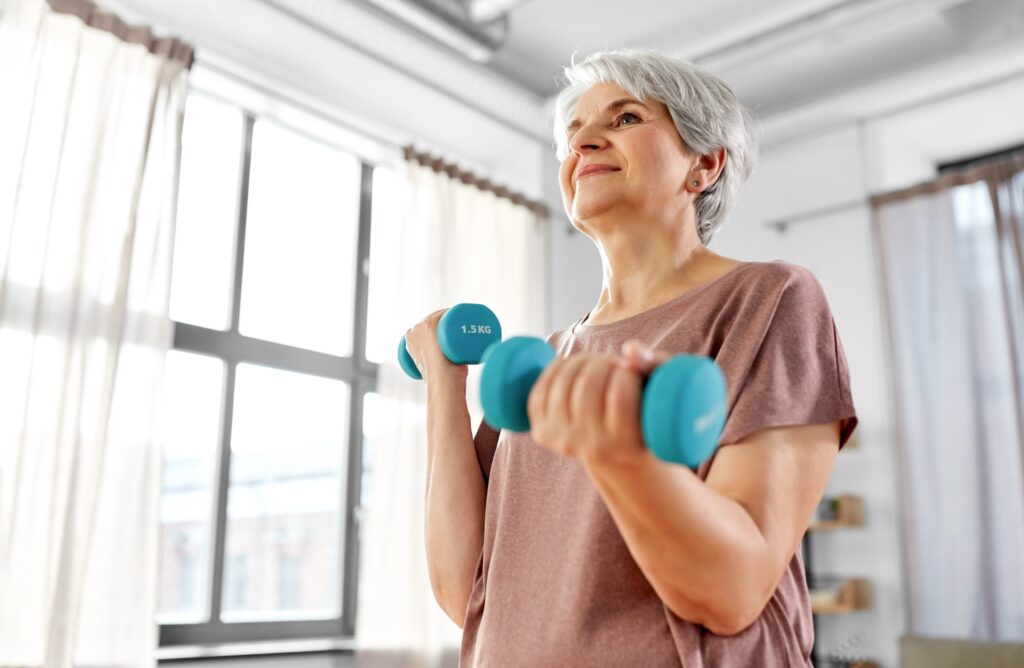 Senior woman lifting weights